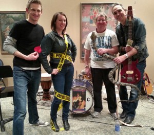 Post-show, the band poses with the (inflatable) star of the scene "Rattlesnake Road."