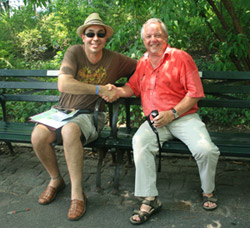 Paul and Freddy shake hands on a (Central) park bench.
